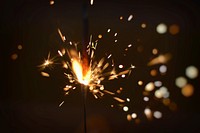 Free burning sparkler on a black background image, public domain CC0 photo.