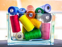 Free colorful sewing thread spools photo, public domain CC0 image.