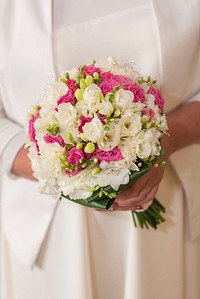 Free bride holding flower bouquet image, public domain CC0 photo.