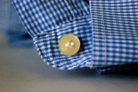 Blue shirt button image, public domain CC0 photo.
