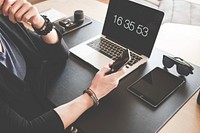 Free woman using a phone on working table image, public domain CC0 photo.