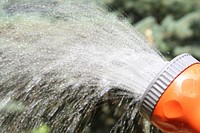 Free garden water sprayer image, public domain CC0 photo.