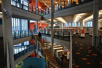 Free big open, multiple level library full of books photo, public domain CC0 image.