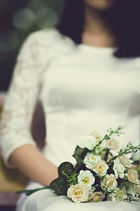 Free bride holding flower bouquet image, public domain CC0 photo.