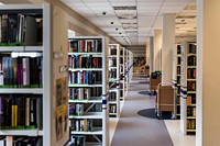 Free library shelves with many books photo, public domain CC0 image.