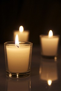 Free candle lights fire in dark background photo, public domain CC0 image.