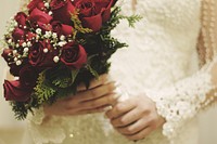 Free bride holding flower bouquet image, public domain CC0 photo.