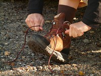 Free tying hiking boots shoelaces image, public domain hiking CC0 photo.