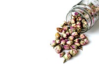 Free dried rose buds, glass jar, white background public domain CC0 photo.