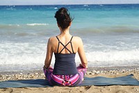 Woman yoga sitting at the beach, free public domain CC0 photo.