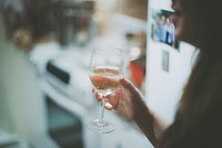 Woman holding wine glass image, free public domain drink CC0 photo.