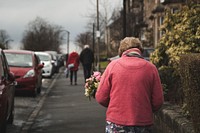 Free old lady holding flower bouquet image, public domain CC0 photo.