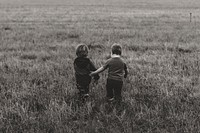 Free sibling holding hands image, public domain CC0.