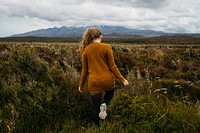 Free lady walking through grass image, public domain nature CC0 photo.