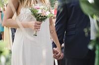 Free bride holding flower bouquet image, public domain CC0 photo.