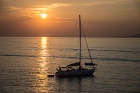 Free sailboat with beautiful sunset image, public domain CC0 photo.