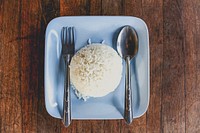 Free cooked rice in blue plate, spoon and fork photo, public domain food CC0 image.