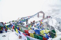 Free religious flags hanging on mountain image, public domain CC0 photo.