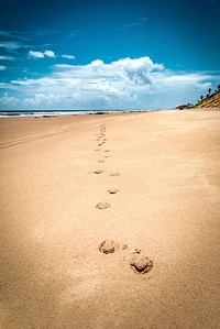 Beach cloudy blue sky landscape, free public domain CC0 photo.