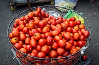 Free image of red tomatoes in a big basket, public domain CC0 photo.