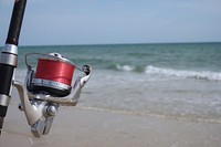 Fishing rod on beach close up, free public domain CC0 photo.