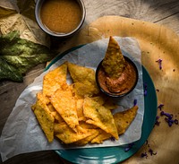 Free dish of nachos with dip spicy sauce image, public domain food CC0 photo.