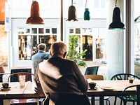 Free man in a coffee shop image, public domain coffee house CC0 photo.