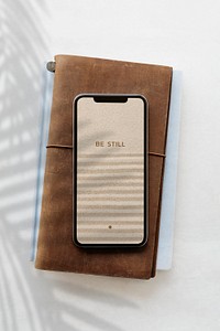 Smartphone screen mockup psd with zen sand as wallpaper