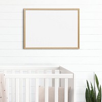 Picture frame mockup psd hanging in nursery room home decor interior