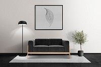 Picture frame mockup psd hanging in a modern living room