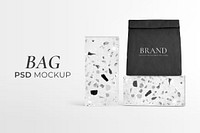 Reusable paper bag mockup psd rolled up in terrazzo pattern