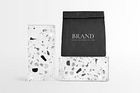 Reusable paper bag mockup psd rolled up in terrazzo pattern