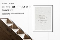 Picture frame mockup psd by stairs and a white wall