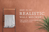 Bathroom wall mockup psd with plant and clothing rack