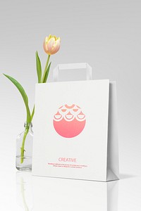 Paper shopping bag mockup psd, with tulip 