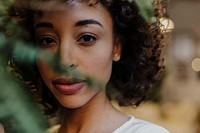 Woman portrait with plant, vivid tone filter