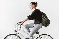 Woman riding bicycle to work, sustainable lifestyle HD photo