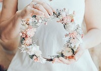 Bride holding a flower crown, wedding photography