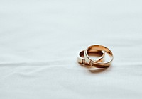 Aesthetic gold wedding rings background with blank space