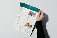 Menu mockup, minimal realistic paper in a person’s hand