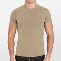 Casual tshirt mockup, simple beige apparel design worn by a young man psd