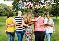 Friends with emoticons enjoying in the park