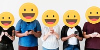 Diverse people with positive emoticons using mobile phones
