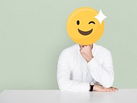 Winking face emoji portrait on a man