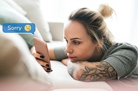 Woman lying in bed texting