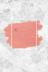 Matte orange paint with a white rectangle frame on a grunge gray background