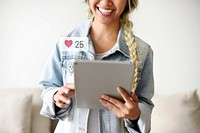 Happy woman using a digital tablet