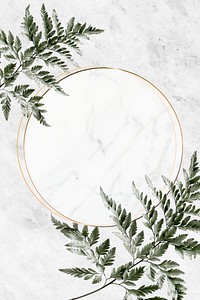 Round golden frame on a marble background