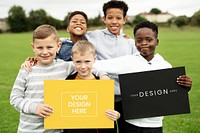 Happy diverse kids holding a sign mockup