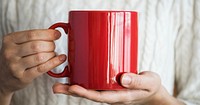 Hands holding a red mug mockup website banner template